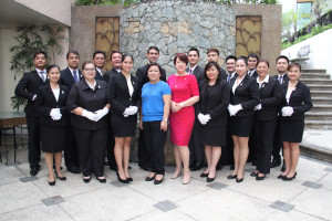 Josephine Ive (in red) with Marinela Trinidad (in blue),    Cravings Group and ASHA CEO, and the graduates of the 7-Star Butler    Service.