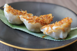 Pan-fried Minced Pork Chive Dumplings topped with Sakura Shrimp